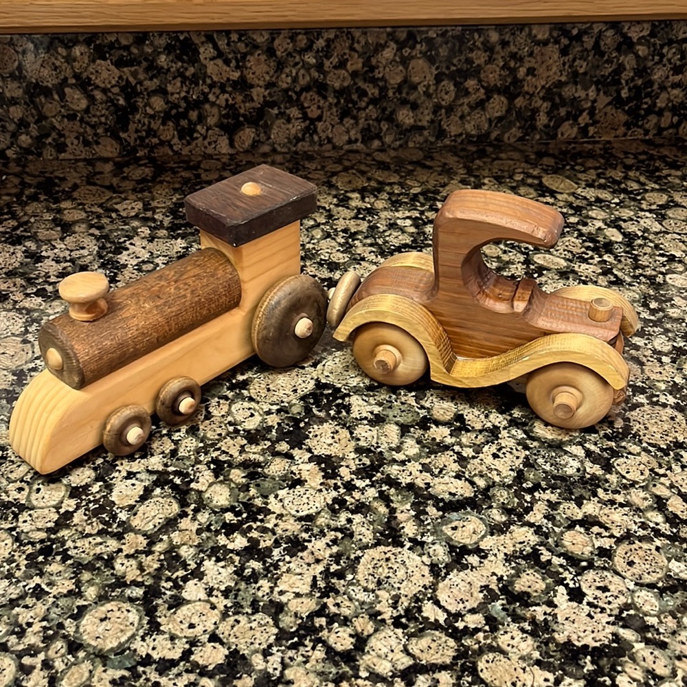 Two wooden toys-car and train with working wheels
